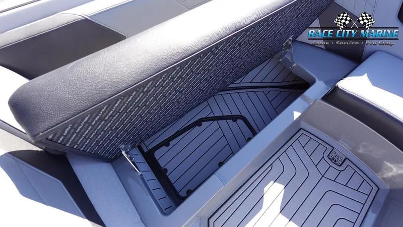 Slide: The Image of 2021 Nautique Super Air Nautique G25 interior seating and storage compartment. - 45
