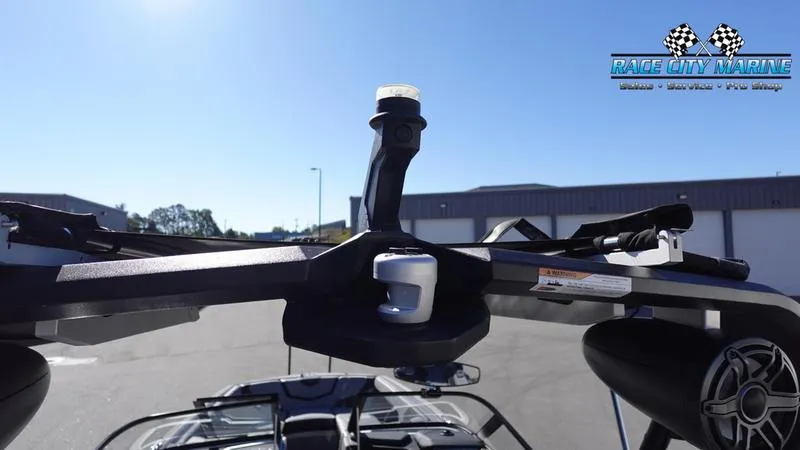 Slide: The Image of 2021 Nautique Super Air Nautique G25 boat tower with speakers and Race City Marine logo. - 49