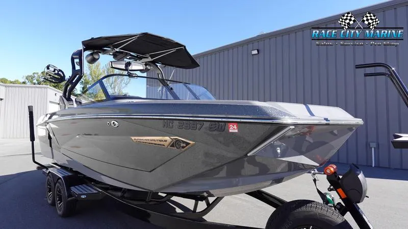 Slide: The Image of 2021 Nautique Super Air Nautique G25 boat at Race City Marine dealership. - 5