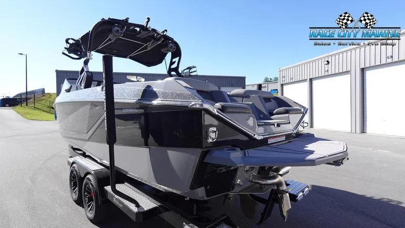 Slide: The Image of 2021 Nautique Super Air Nautique G25 boat on trailer at Race City Marine. - 7