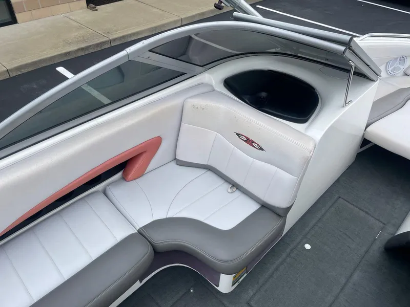 Slide: The Image of 2005 MasterCraft X-10 boat interior with white and gray seating. - 12