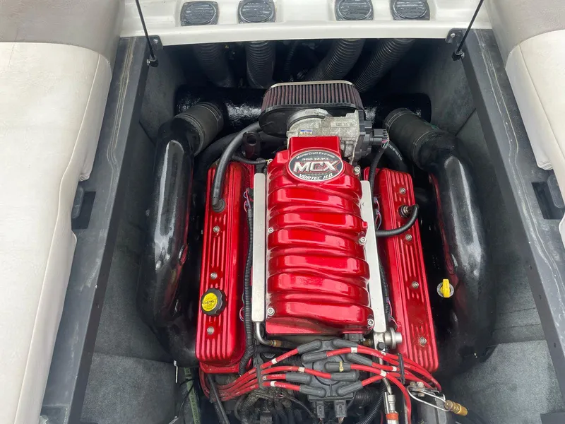 Slide: The Image of 2005 MasterCraft X-10 boat engine with red MCX cover. - 8