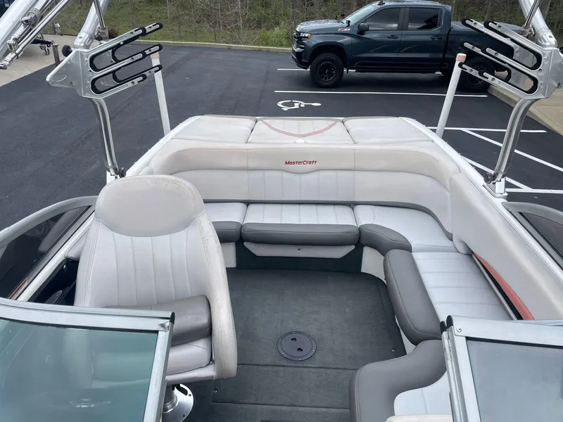 Slide: The Image of 2005 MasterCraft X-10 boat interior with seating and wakeboard racks. - 9