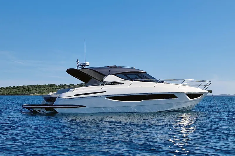 The Image of Luxury Focus Power 36 yacht, 2025 model, cruising on clear blue water. - 1
