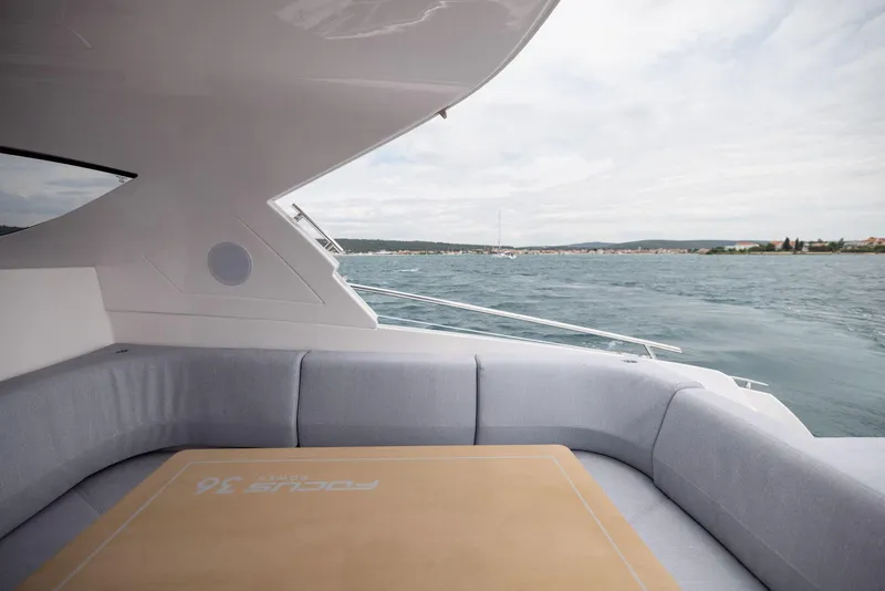 Slide: The Image of Luxury seating area on 2025 Focus Power 36 yacht with ocean view. - 10