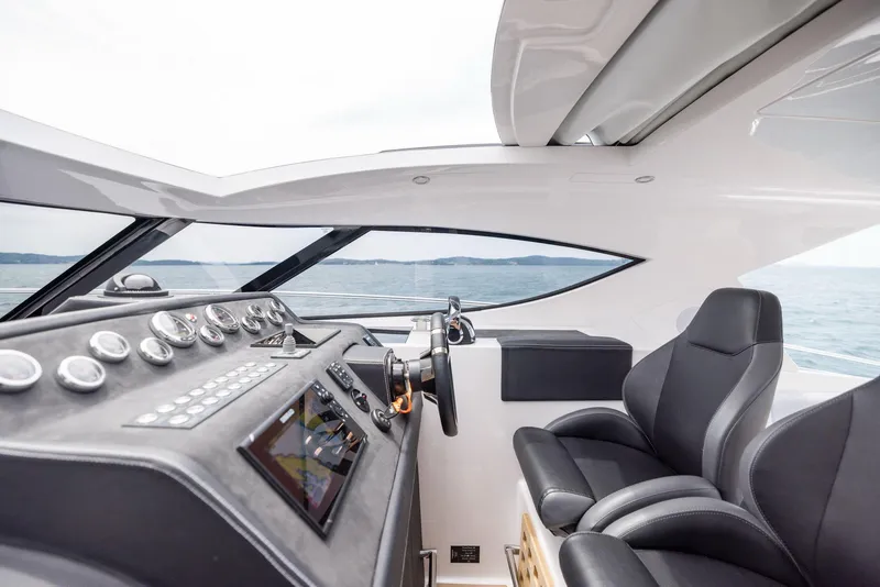 Slide: The Image of Interior of 2025 Focus Power 36 yacht with modern dashboard and leather seating. - 17