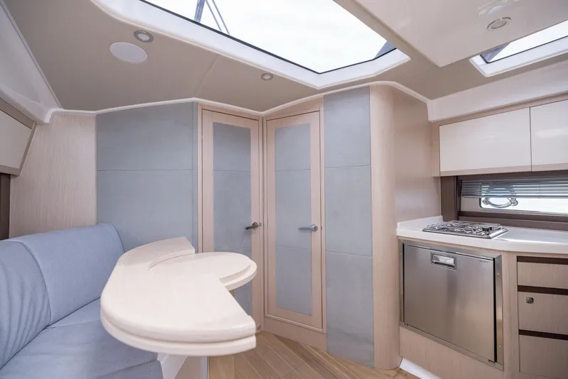 Slide: The Image of Modern interior of 2025 Focus Power 36 yacht with sleek kitchen and seating area. - 25