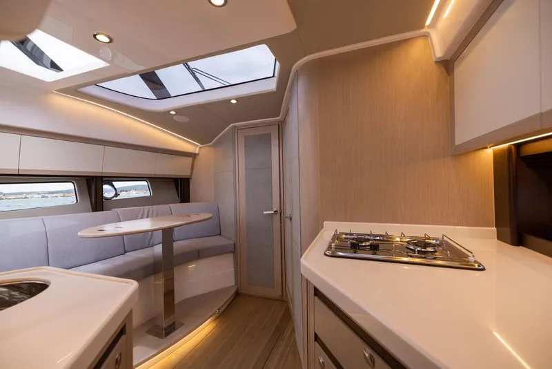 Slide: The Image of Luxurious interior of 2025 Focus Power 36 yacht with modern kitchen and seating area. - 28