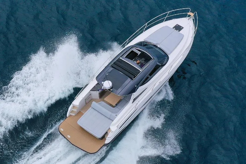 Slide: The Image of 2025 Focus Power 36 yacht cruising on open water, aerial view. - 3