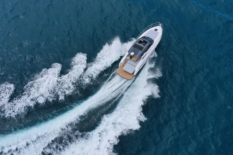 Slide: The Image of Aerial view of 2025 Focus Power 36 yacht cruising on blue ocean waters. - 4