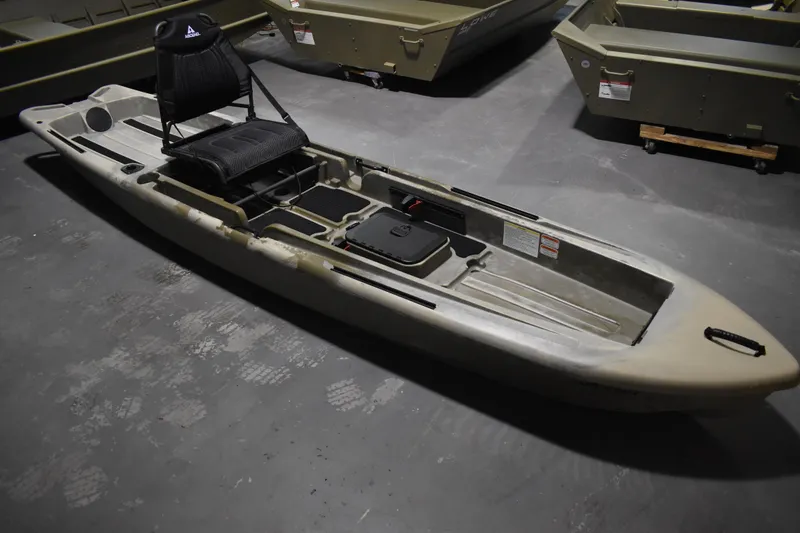 The Image of 2024 Ascend 128X Yak-Power Sit-On kayak in a showroom setting. - 0