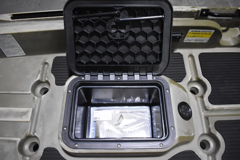 Slide: The Image of 2024 Ascend 128X Yak-Power Sit-On kayak storage compartment with open hatch. - 10