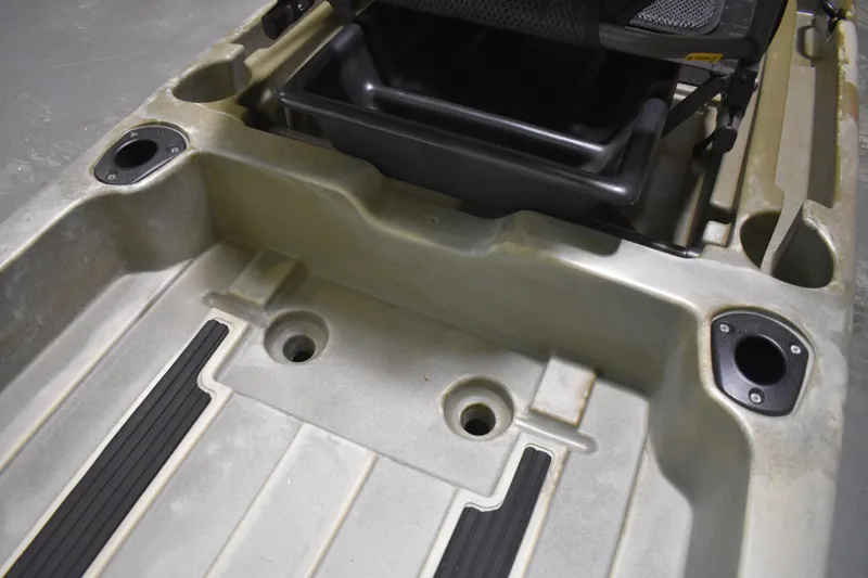 Slide: The Image of 2024 Ascend 128X Yak-Power Sit-On kayak interior with rod holders and storage. - 16