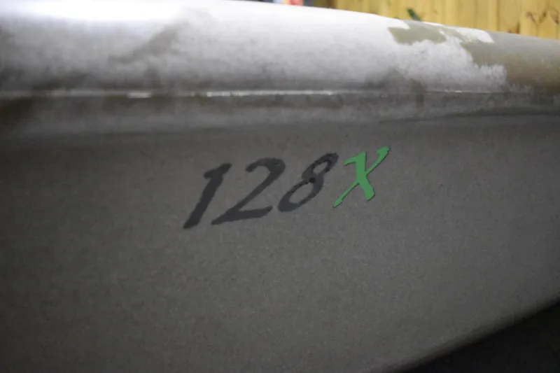 Slide: The Image of Close-up of 2024 Ascend 128X Yak-Power Sit-On kayak model number. - 17