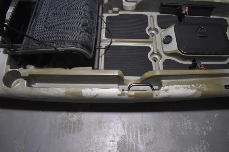 Slide: The Image of 2024 Ascend 128X Yak-Power Sit-On kayak interior with seat and storage compartments. - 9