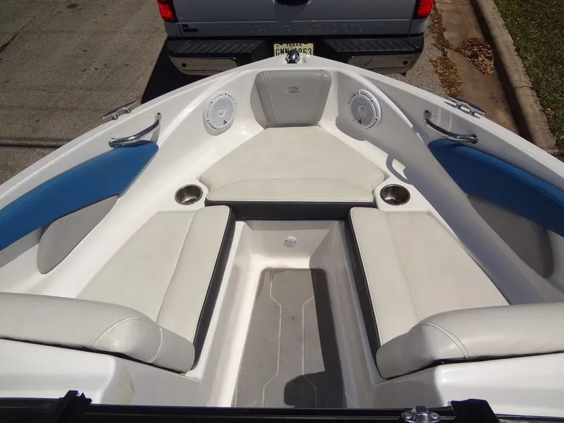 Slide: The Image of 2019 Regal 1900 ESX boat interior with white and blue seating. - 10