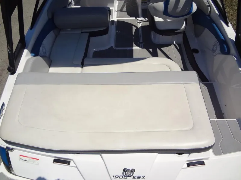 Slide: The Image of 2019 Regal 1900 ESX boat interior with white and gray seating. - 11