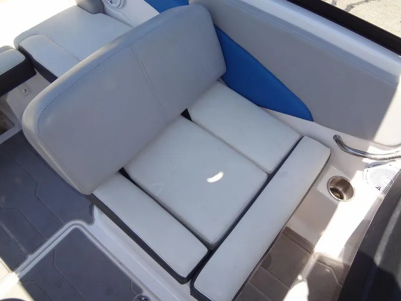 Slide: The Image of 2019 Regal 1900 ESX boat interior seating with gray and blue upholstery. - 13