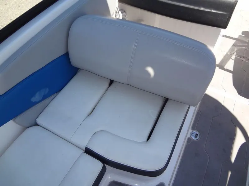 Slide: The Image of 2019 Regal 1900 ESX boat interior seating with white and blue upholstery. - 14