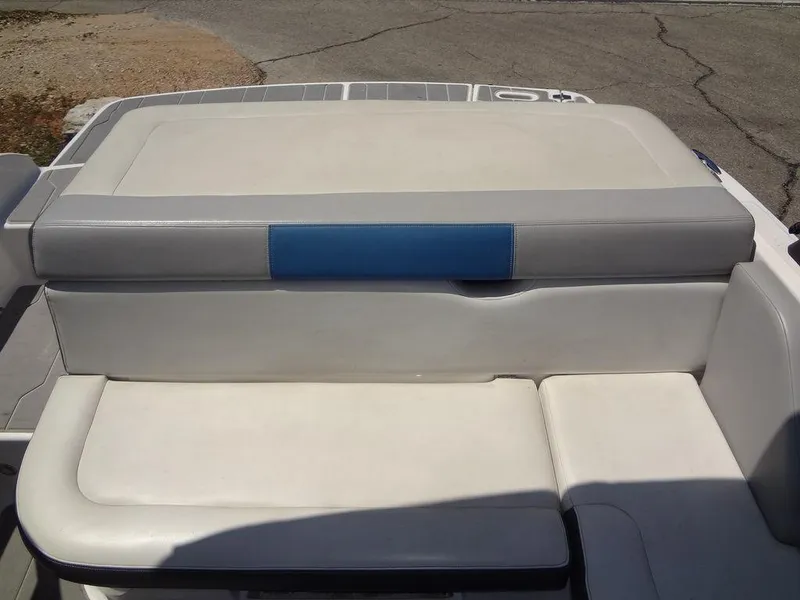 Slide: The Image of 2019 Regal 1900 ESX boat with white and blue cushioned seating. - 16