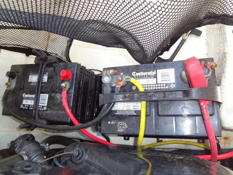 Slide: The Image of 2019 Regal 1900 ESX boat battery compartment with Continental batteries. - 24