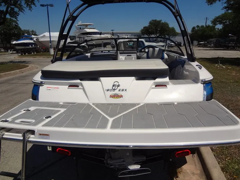 Slide: The Image of 2019 Regal 1900 ESX boat rear view at marina. - 9