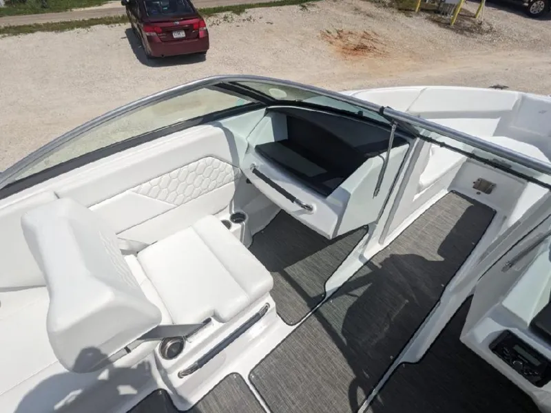 Slide: The Image of 2023 Four Winns H1 OB boat interior with white seating and modern design. - 14