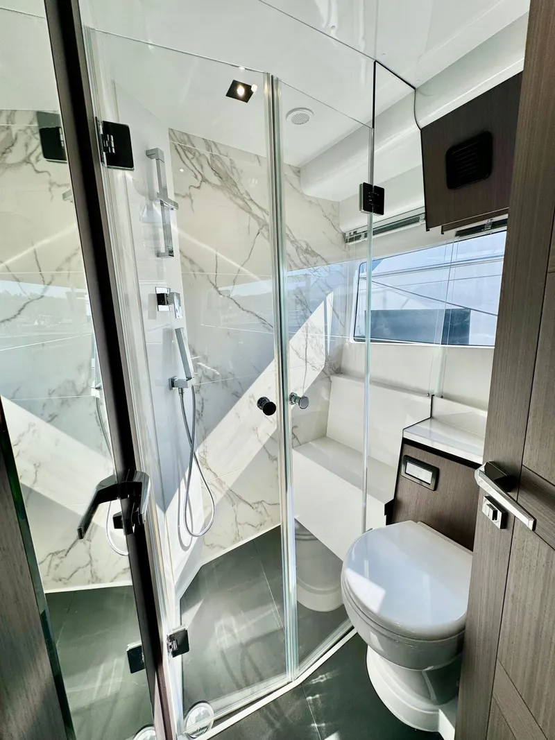 Slide: The Image of Luxurious bathroom in 2025 Galeon 500 Fly yacht with modern fixtures and glass shower. - 33