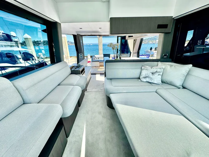 Slide: The Image of Luxurious interior of 2025 Galeon 500 Fly yacht with spacious seating and ocean view. - 44