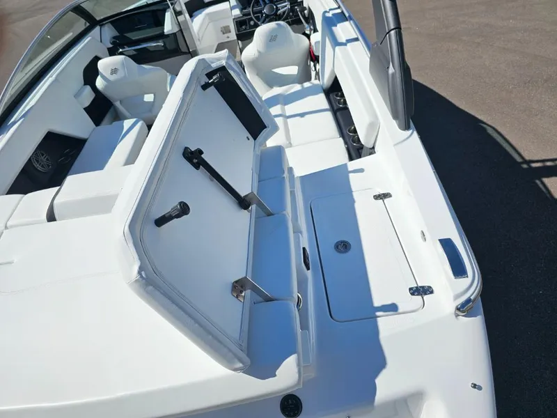 Slide: The Image of 2025 Four Winns H4 boat interior with open storage compartments and seating. - 10