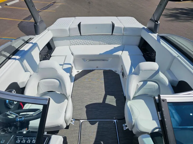 Slide: The Image of 2025 Four Winns H4 boat interior with white leather seating and modern design. - 14