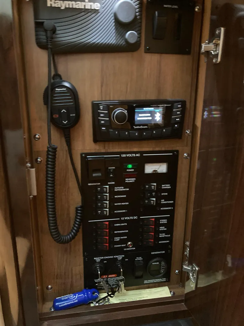 Slide: The Image of Control panel of a 2016 Sea Ray 330 Sundancer boat with communication equipment. - 10