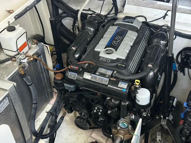 Slide: The Image of Engine compartment of a 2016 Sea Ray 330 Sundancer boat, featuring a 6.2L engine. - 25