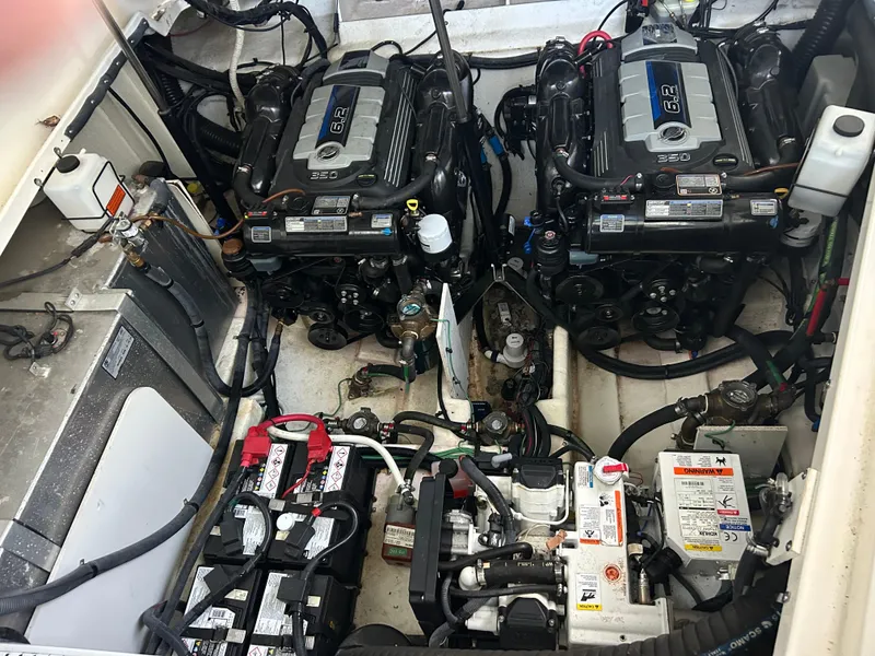 Slide: The Image of Engine compartment of a 2016 Sea Ray 330 Sundancer with dual engines and batteries. - 26