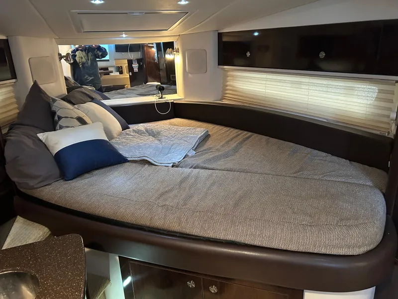 Slide: The Image of Luxurious interior cabin of 2016 Sea Ray 330 Sundancer yacht with cozy bedding. - 33