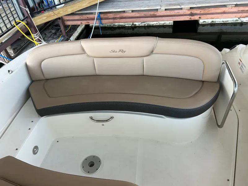 Slide: The Image of 2016 Sea Ray 330 Sundancer boat seating area with beige upholstery. - 35