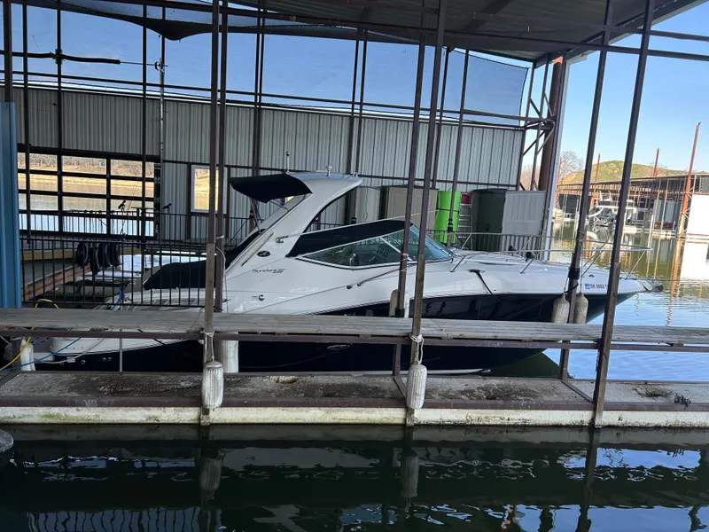 Slide: The Image of 2016 Sea Ray 330 Sundancer docked in a marina. - 4