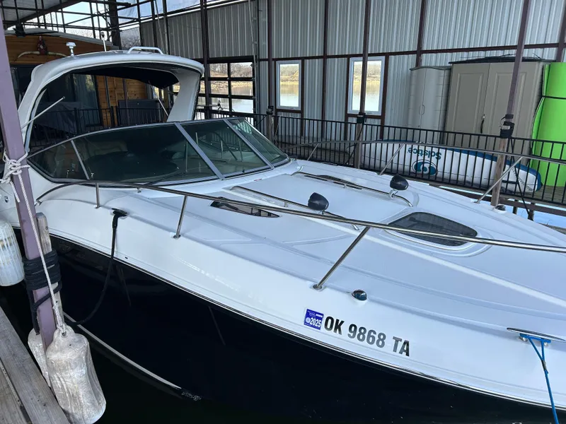 Slide: The Image of 2016 Sea Ray 330 Sundancer docked in a covered marina. - 44