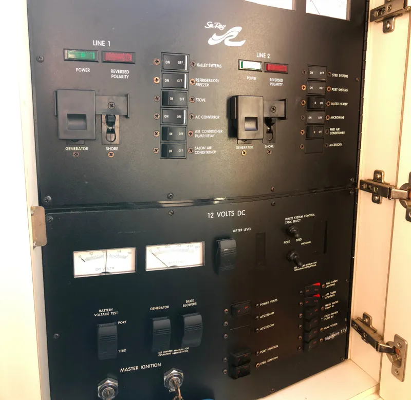 Slide: The Image of Electrical control panel on a 1995 Sea Ray 450 Sundancer boat. - 27
