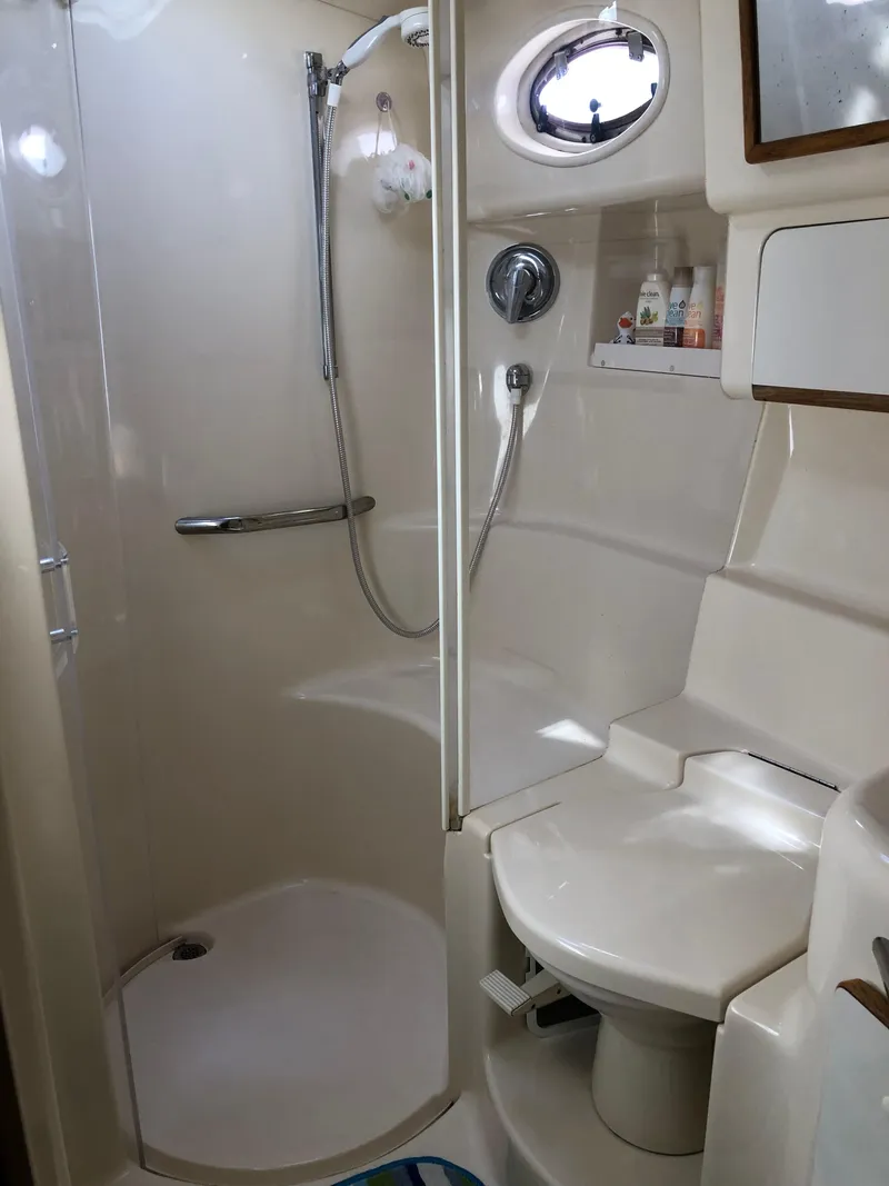 Slide: The Image of Bathroom interior of 1995 Sea Ray 450 Sundancer yacht, featuring shower and toilet. - 44