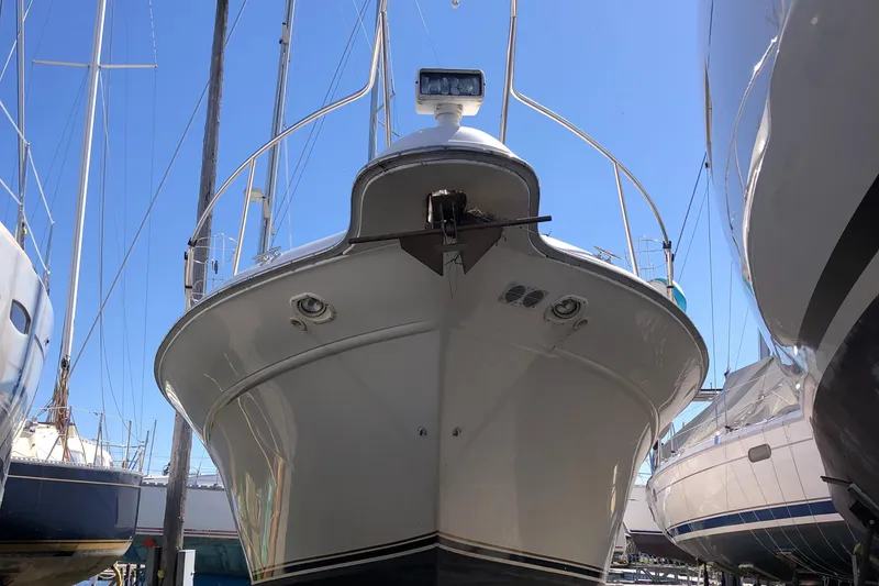 Slide: The Image of 1995 Sea Ray 450 Sundancer yacht in dry dock, viewed from the front. - 5