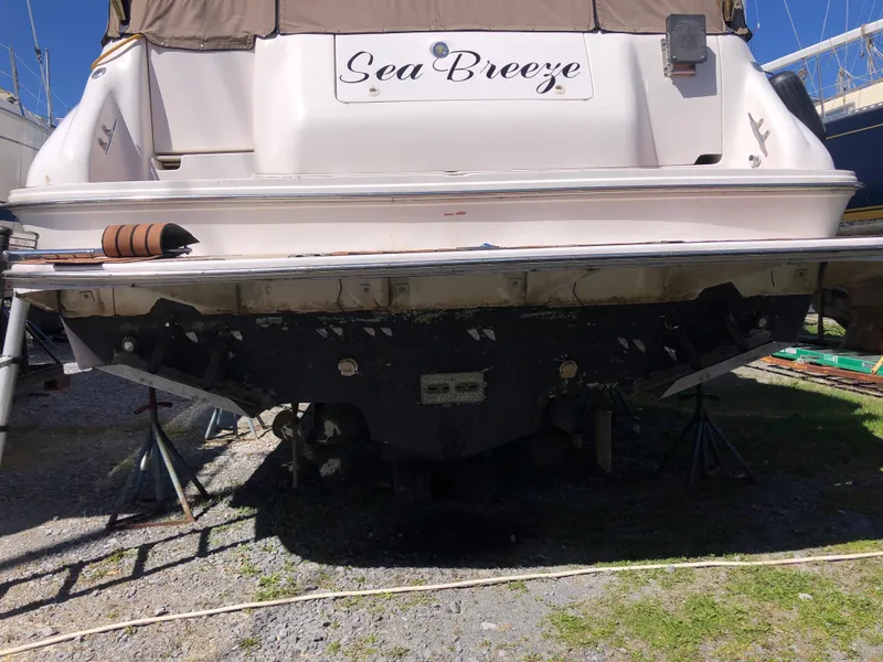 Slide: The Image of 1995 Sea Ray 450 Sundancer boat named "Sea Breeze" on dry dock for maintenance. - 8
