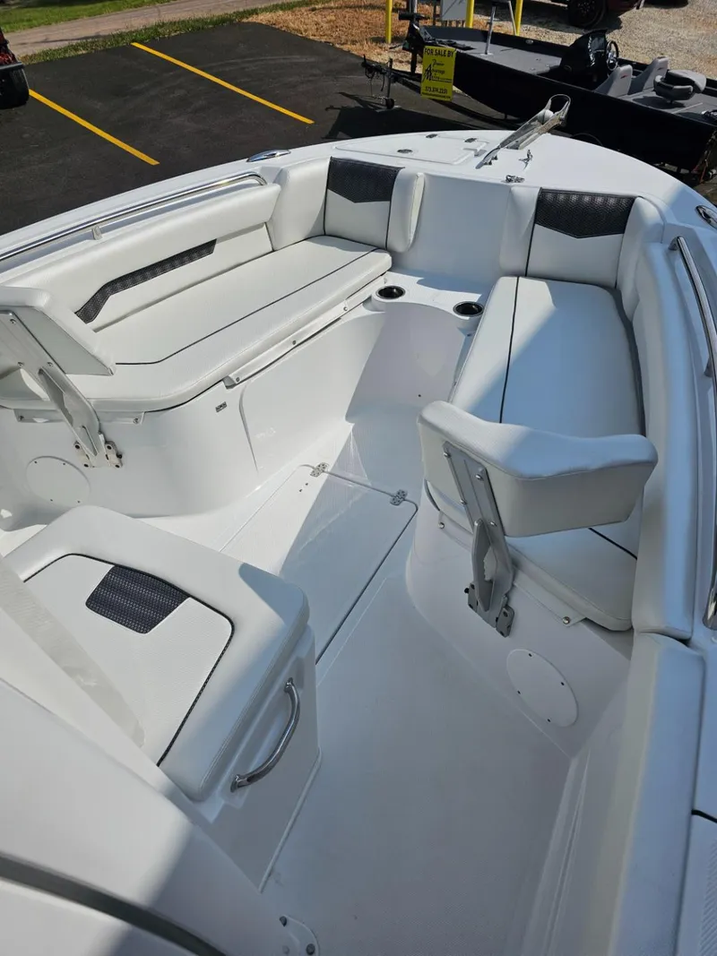 Slide: The Image of 2025 Wellcraft 223 Fisherman boat interior with seating and storage. - 10