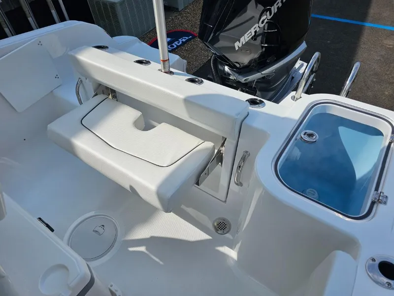 Slide: The Image of 2025 Wellcraft 223 Fisherman boat interior with seating and storage features. - 15