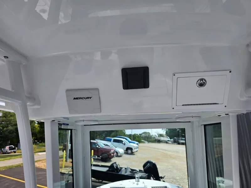 Slide: The Image of Interior view of 2025 Wellcraft 223 Fisherman boat with Mercury equipment. - 19