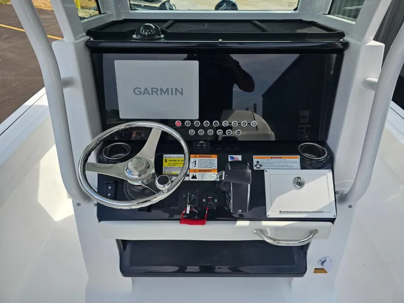 Slide: The Image of 2025 Wellcraft 223 Fisherman boat dashboard with Garmin navigation system. - 7
