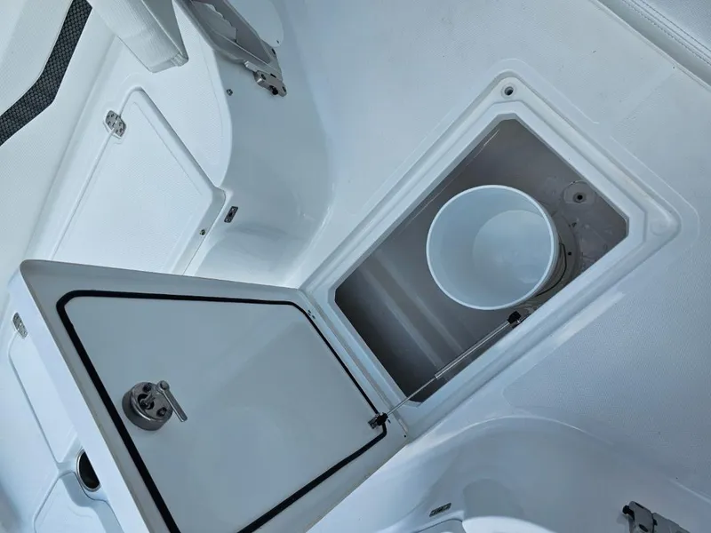 Slide: The Image of Open storage compartment on 2025 Wellcraft 243 Fisherman boat. - 12