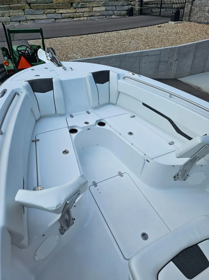 Slide: The Image of 2025 Wellcraft 243 Fisherman boat interior with seating and storage compartments. - 13