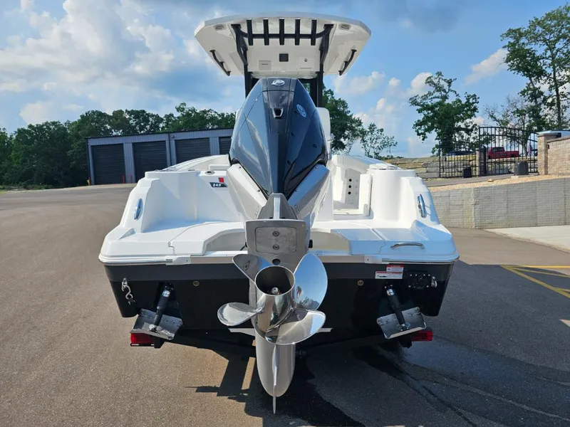 Slide: The Image of 2025 Wellcraft 243 Fisherman boat rear view with outboard motor. - 3