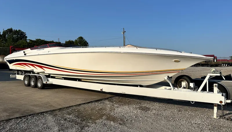 The Image of 2007 Fountain 47 Lightning speedboat on trailer, white with red and yellow accents. - 15